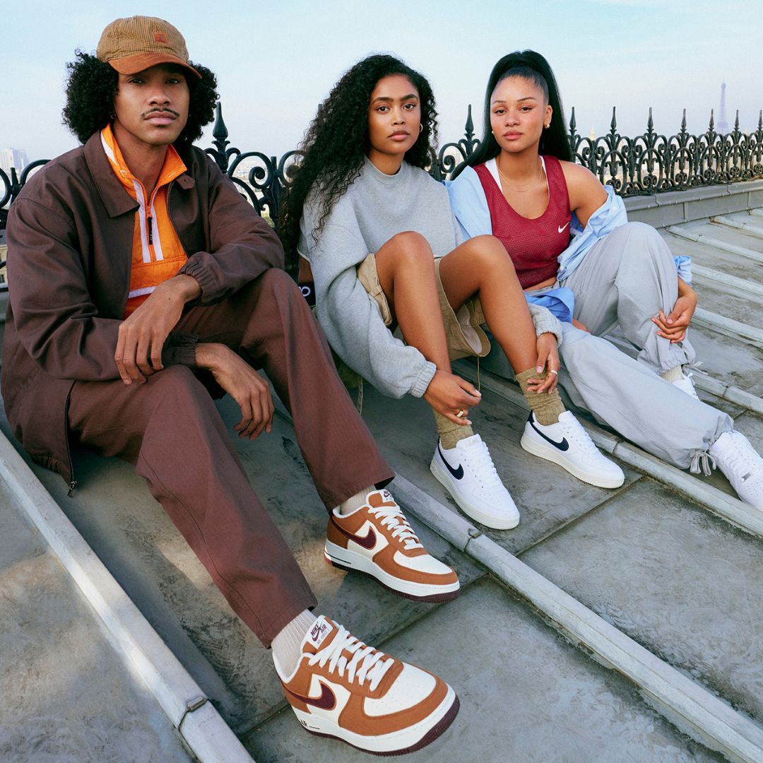 3 woman and men wearing nike clothes and shoes
