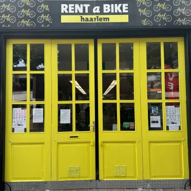 Rent A bike Haarlem geel deur